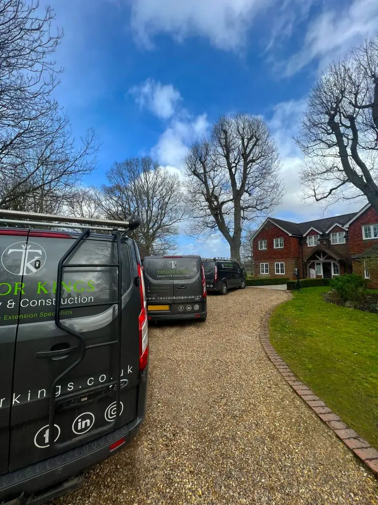 3 of the Taylor Kings work vans approaching a house ready to complete renovations