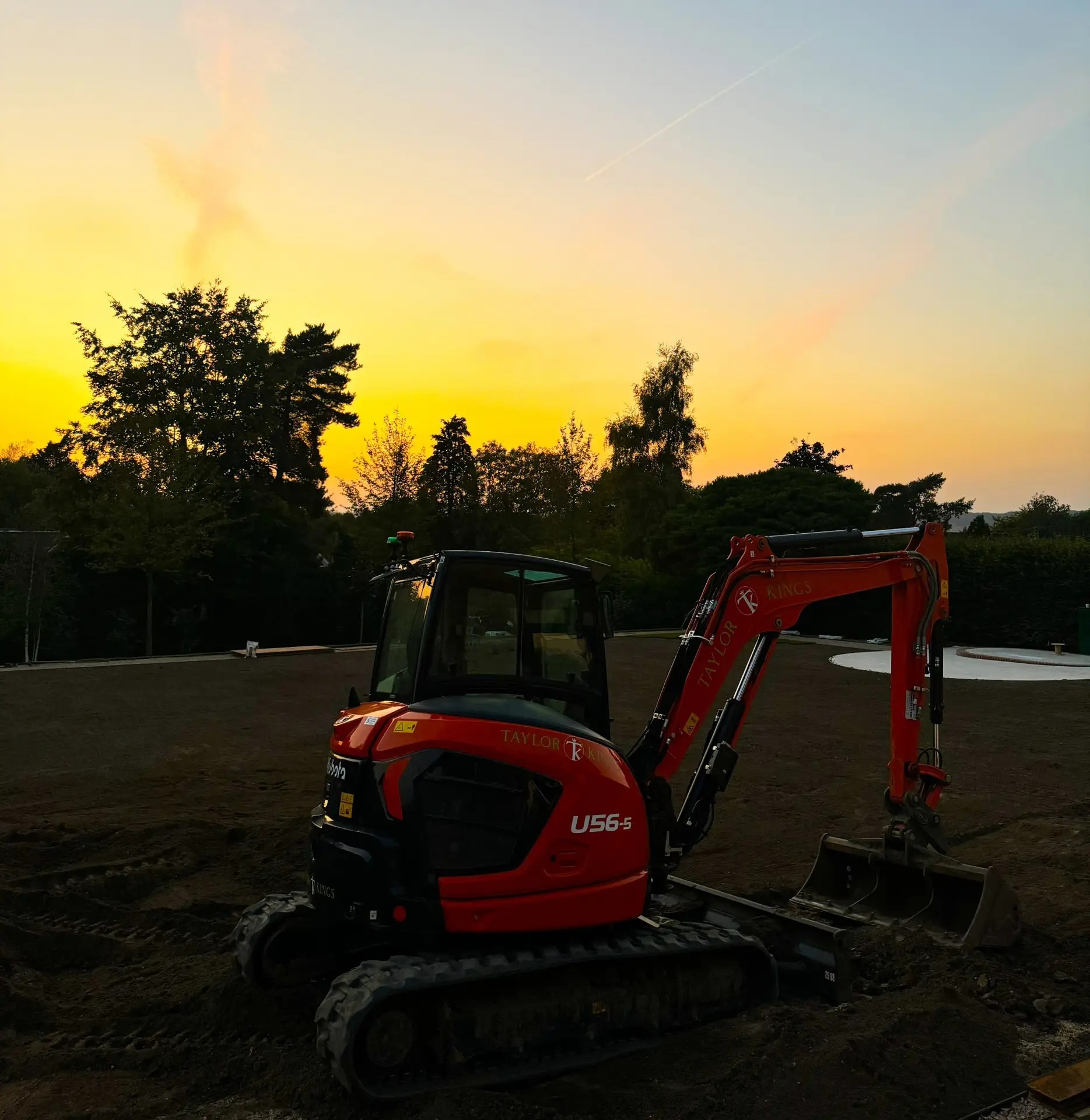 New six tonne excavator on a construction site in Kent at sunset