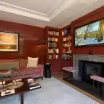 Marble fireplace surround within a private library