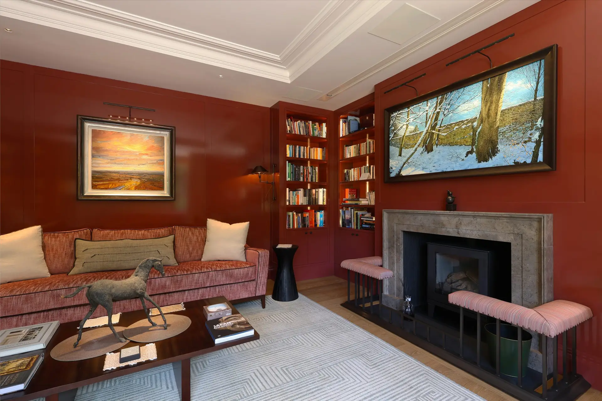 Marble fireplace surround within a private library